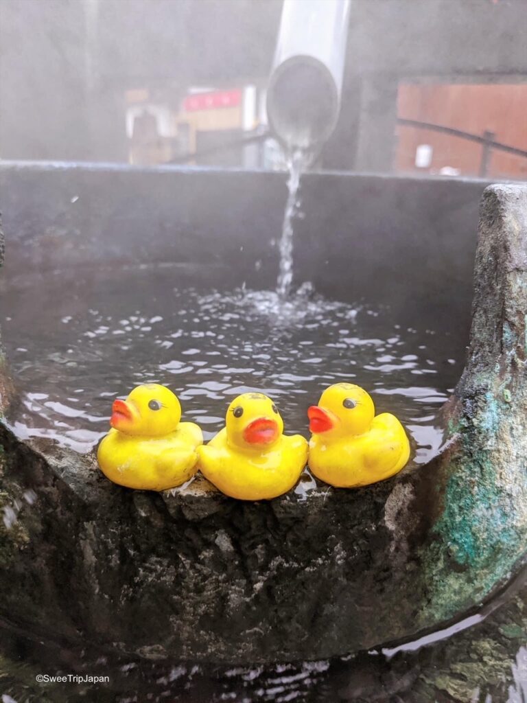yellow gummy ducks in hot spring