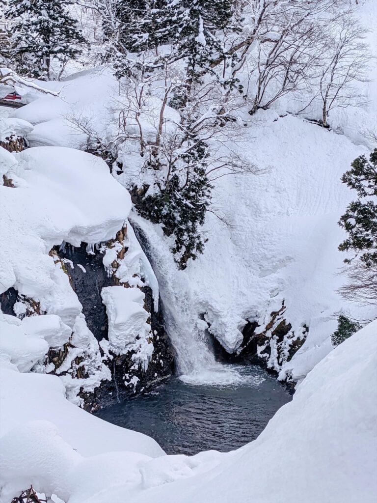 Shirogane-no-Taki Falls covered with snow